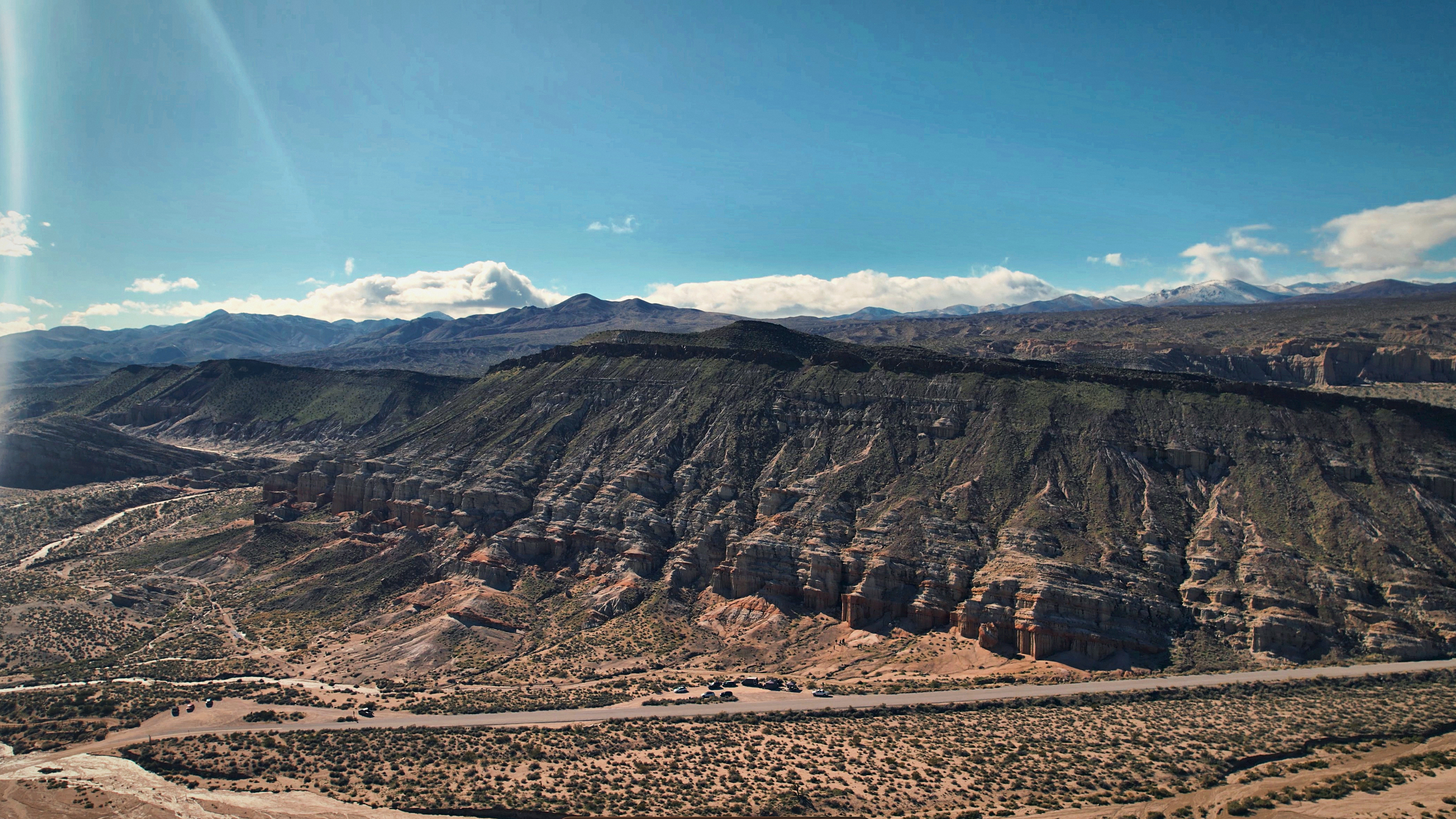 SKYSPECS Digital aerial landscape photograph showing desert canyon terrain and cinematic location atmosphere