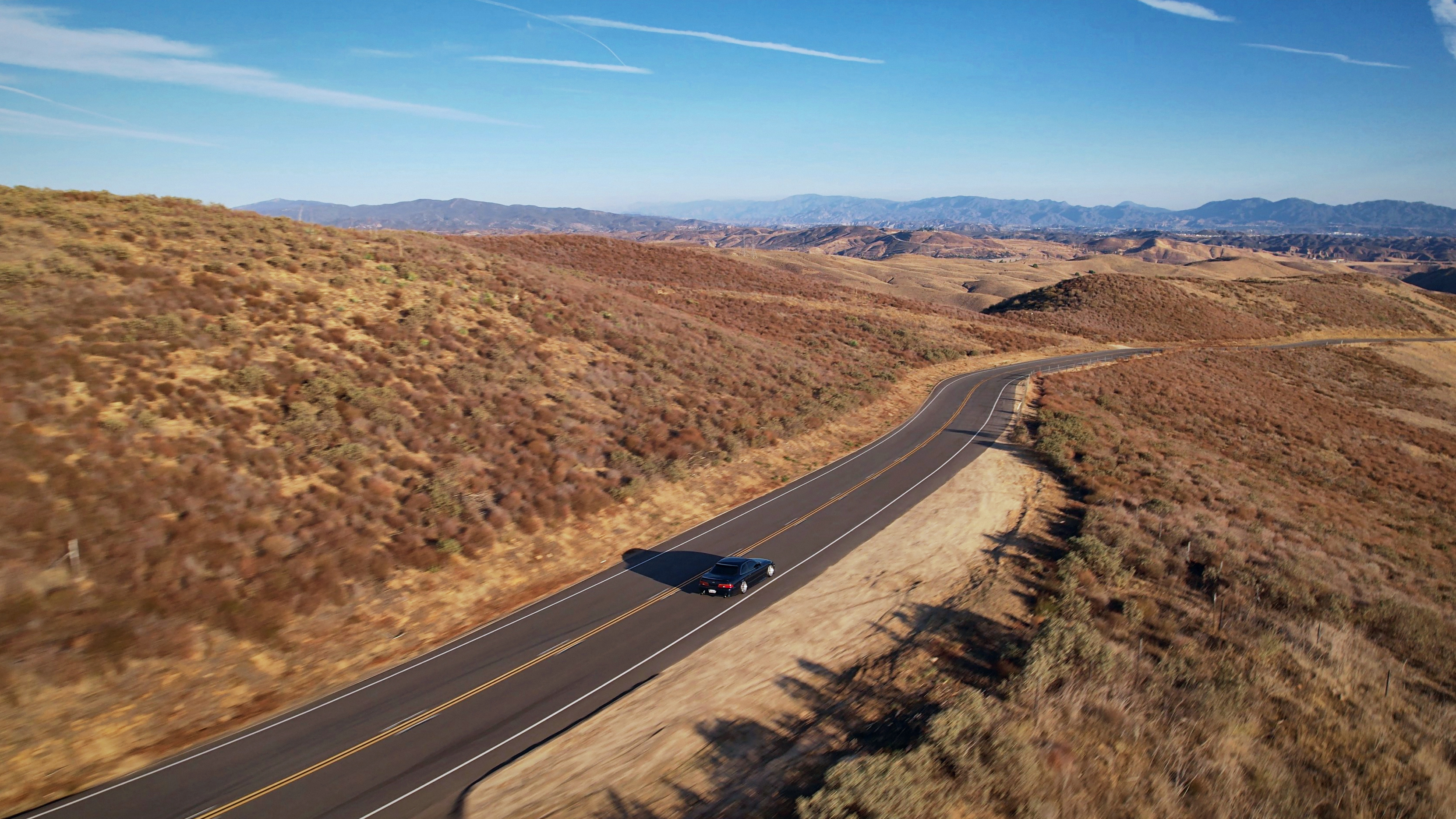 SKYSPECS Digital automotive visual study showing a vehicle on a Southern California canyon road