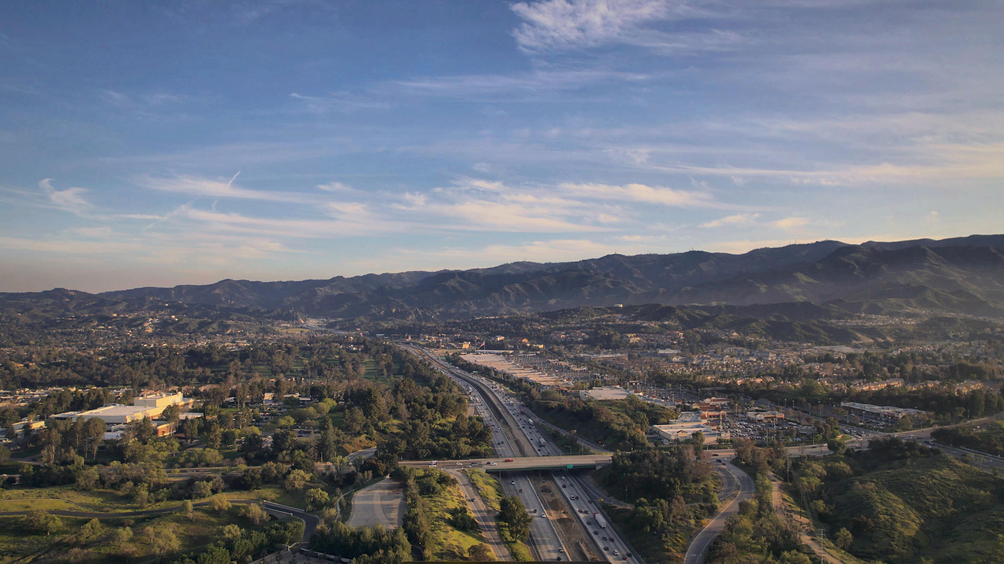 SKYSPECS Digital aerial cityscape photograph showing Santa Clarita valley and surrounding terrain